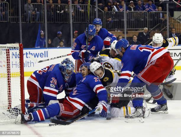The New York Rangers defend the net against the Boston Bruins during the third period at Madison Square Garden on November 8, 2017 in New York City....