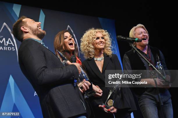 Jimi Westbrook, Kimberly Schlapman, Karen Fairchild and Philip Sweet of Little Big Town pose in the press room at the 51st annual CMA Awards at the...