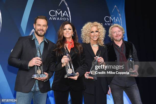 Jimi Westbrook, Kimberly Schlapman, Karen Fairchild and Philip Sweet of Little Big Town pose in the press room at the 51st annual CMA Awards at the...