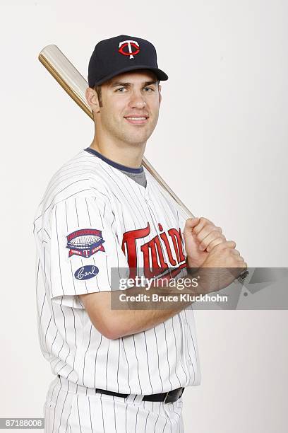 Joe Mauer of the Minnesota Twins poses with the 2008 Batting Title Award he earned before the game against the Seattle Mariners on May 9, 2009 at the...