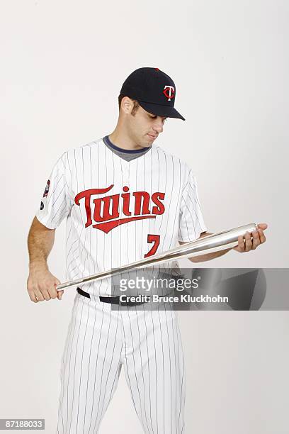 Joe Mauer of the Minnesota Twins poses with the 2008 Batting Title Award he earned before the game against the Seattle Mariners on May 9, 2009 at the...