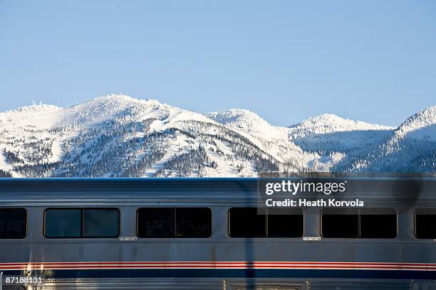 a train passes in front of a ski resort. - montana western usa 個照片及圖片檔