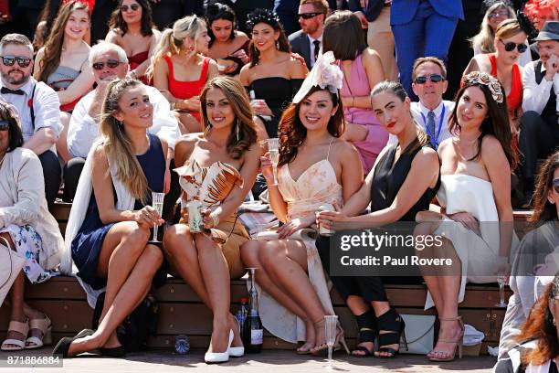 Racegoers enjoy the fashions, colour and atmosphere on Kennedy Oaks Day at Flemington Racecourse on November 9, 2017 in Melbourne, Australia. A crowd...