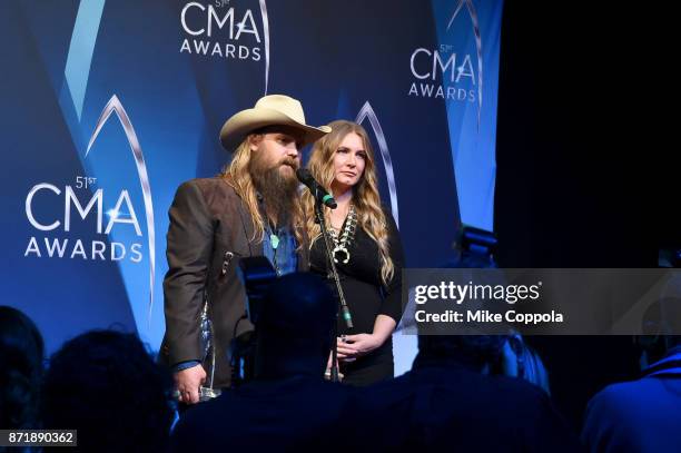 Chris Stapleton and Morgane Stapleton pose in the press room at the 51st annual CMA Awards at the Bridgestone Arena on November 8, 2017 in Nashville,...
