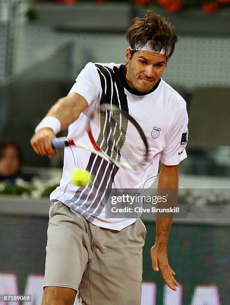 Tommy Haas of Germany plays a backhand against Andy Roddick of the USA in their second round match during the Madrid Open tennis tournament at the...