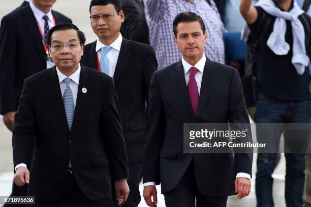 Mexico's President Enrique Pena Nieto arrives at the international airport ahead of the Asia-Pacific Economic Cooperation Summit in the central...