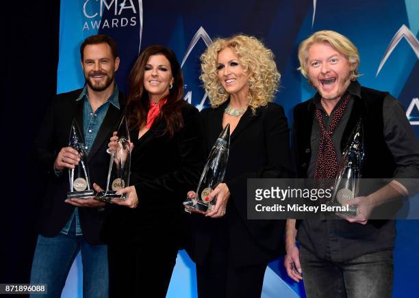 Jimi Westbrook, Karen Fairchild, Kimberly Schlapman and Philip Sweet of Little Big Town pose in the press room during the 51st annual CMA Awards at...