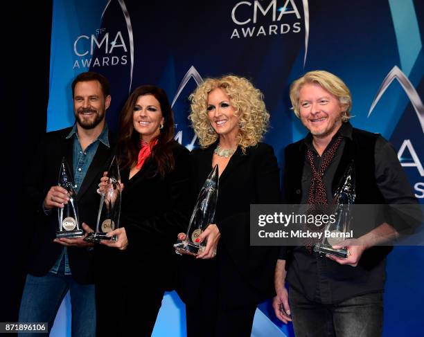 Jimi Westbrook, Karen Fairchild, Kimberly Schlapman and Philip Sweet of Little Big Town pose in the press room during the 51st annual CMA Awards at...