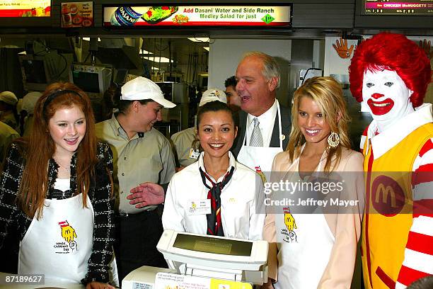 Renee Olstead, McDonald's personnel, Jim Cantalupo, McDonald's Chairman and CEO, center, Jessica Simpson and Ronald McDonald