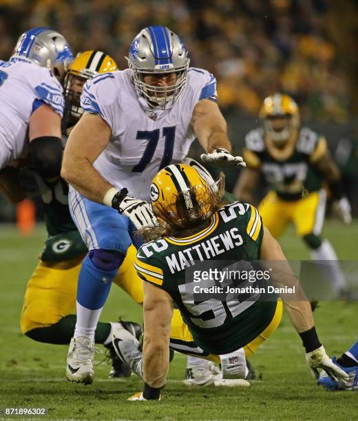 Clay Matthews of the Green Bay Packers is knocked to the ground by Ricky Wagner of the Detroit Lions at Lambeau Field on September 28, 2017 in Green...