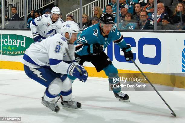 Joonas Donskoi of the San Jose Sharks skates against Tyler Johnson of the Tampa Bay Lightning at SAP Center on November 8, 2017 in San Jose,...