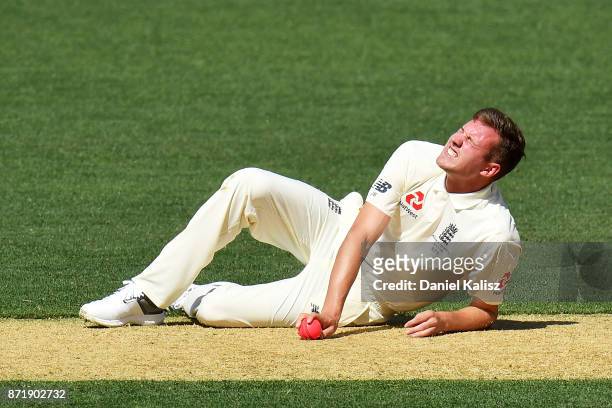 Jake Ball of England falls and injuries himself while bowling during day two of the Four Day Tour match between the Cricket Australia XI and England...