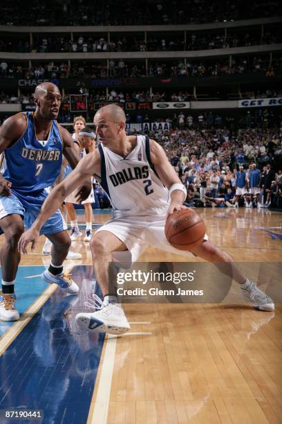 Jason Kidd of the Dallas Mavericks drives to the basket against Chauncey Billups of the Denver Nuggets in Game Three of the Western Conference...