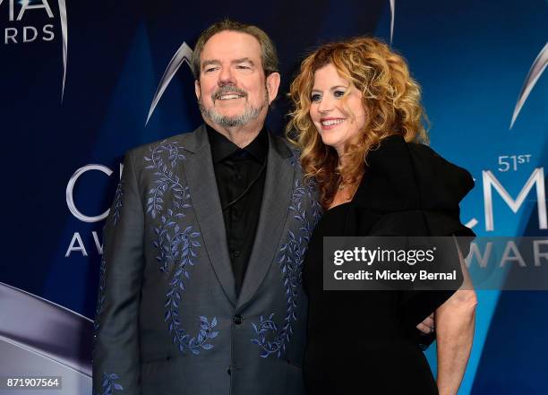 Songwriter Jimmy Webb and Laura Savini pose in the press room during the 51st annual CMA Awards at the Bridgestone Arena on November 8, 2017 in...