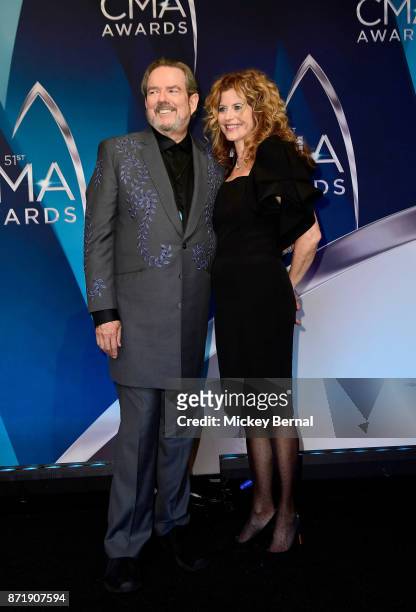 Songwriter Jimmy Webb and Laura Savini pose in the press room during the 51st annual CMA Awards at the Bridgestone Arena on November 8, 2017 in...
