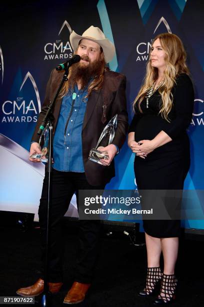 Chris Stapleton and wife Morgane Stapleton speak in the press room during the 51st annual CMA Awards at the Bridgestone Arena on November 8, 2017 in...