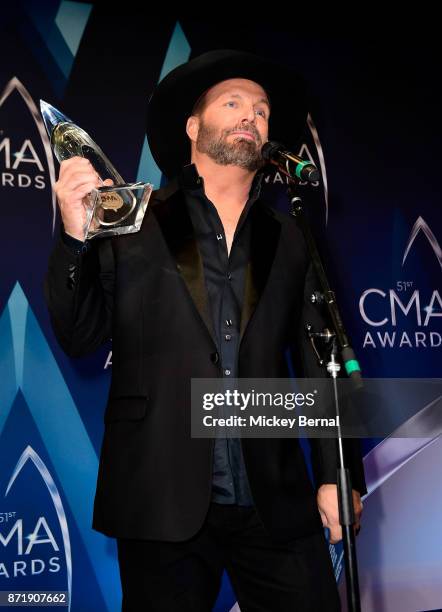 Garth Brooks, winner of the Entertainer Of The Year award, speaks in the press room during the 51st annual CMA Awards at the Bridgestone Arena on...