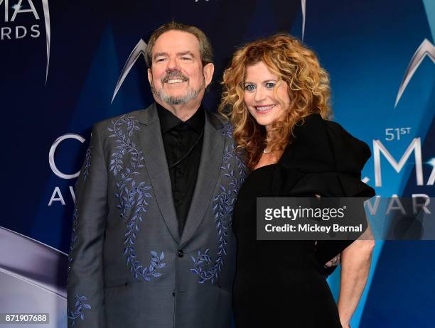 Songwriter Jimmy Webb and Laura Savini pose in the press room during the 51st annual CMA Awards at the Bridgestone Arena on November 8, 2017 in...