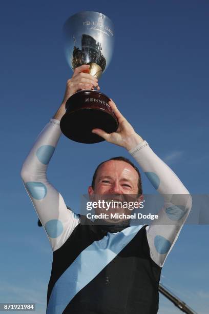 Stephen Baster poses with the trophy after winning on Pinot in race 8 the Kennedy Oaks on 2017 Oaks Day at Flemington Racecourse on November 9, 2017...