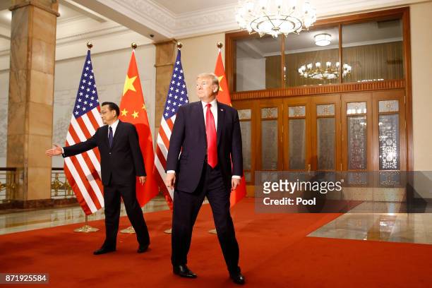 President Donald Trump meets with China's Premier Li Keqiang before a meeting at the Great Hall of the People on November 9, 2017 in Beijing, China....