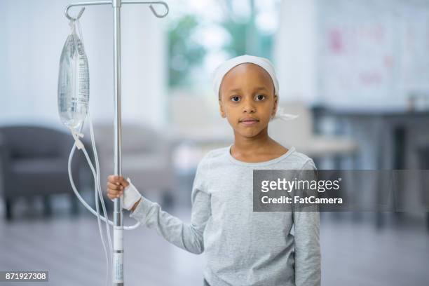 girl with iv - bald girl stock pictures, royalty-free photos & images