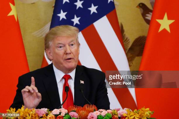 President Donald Trump and China's President Xi Jinping make a joint statement at the Great Hall of the People on November 9, 2017 in Beijing, China....
