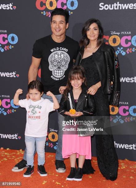 Mario Lopez, wife Courtney Laine Mazza and children Dominic Lopez and Gia Francesca Lopez attend the premiere of "Coco" at El Capitan Theatre on...