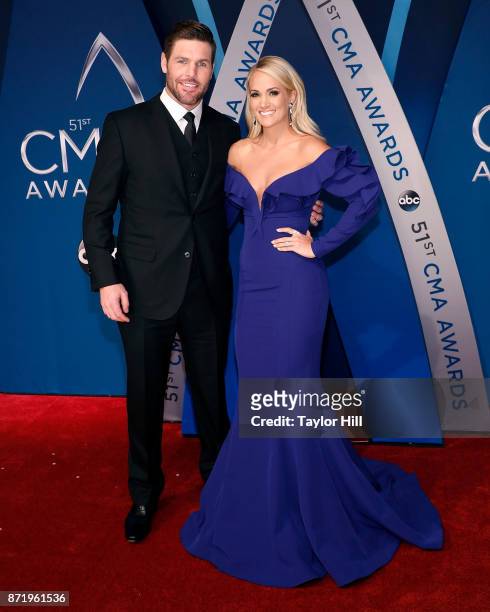 Mike Fisher and Carrie Underwood attend the 51st annual CMA Awards at the Bridgestone Arena on November 8, 2017 in Nashville, Tennessee.