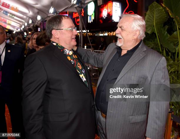 Executive producer John Lasseter and actor John Ratzenberger arrive at the premiere of Disney Pixar's "Coco" at the El Capitan Theatre on November 8,...