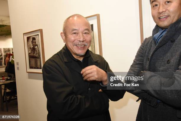 Chinese Sculptor Wang Keping and chinese photographer/artist Liu Bolin attend Paris Photo 2017 Preview at Grand Palais on November 8, 2017 in Paris,...