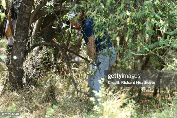 Tommy Fleetwood of England hits out of trouble on the 3rd hole during the first round of the Nedbank Golf Challenge at Gary Player CC on November 9,...