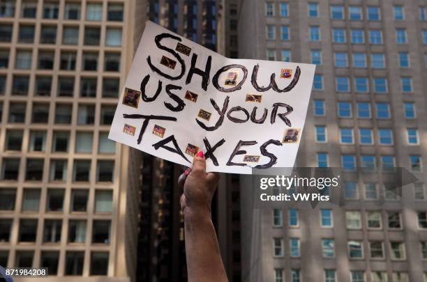 Several thousand people marched asking President Donald J. Trump to release his income tax returns. Others protested against the President's...