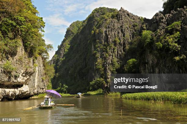 boat trip on the ngo dong river in tam coc, ninh bình province, vietnam - dong tam stock pictures, royalty-free photos & images