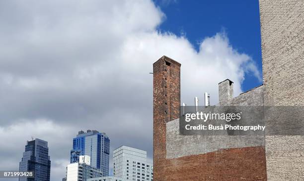 contrast between old buildings and new office towers in downtown brooklyn, new york city - brick chimney stock pictures, royalty-free photos & images