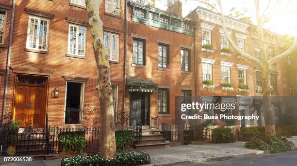 elegant brownstones and townhouses in the west village. manhattan, new york city - row house imagens e fotografias de stock