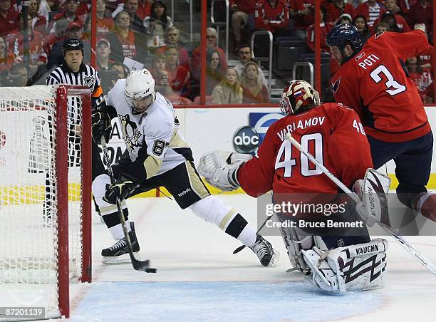 Simeon Varlamov of the Washington Capitals fails to stop a first period goal by Sidney Crosby of the Pittsburgh Penguins during Game Seven of the...