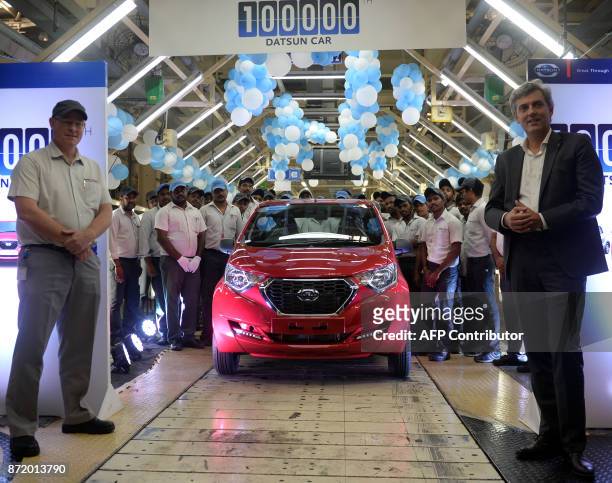 Managing Director of Nissan Motor India Jerome Saigot and CEO and Managing Director of Renault Nissan Automotive India Colin MacDonald pose for a...