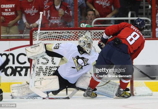 Alex Ovechkin of the Washington Capitals is stopped by Marc-Andre Fleury of the Pittsburgh Penguins during first period action in Game Seven of the...