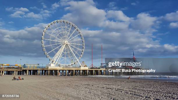 will steel pier's observation wheel on the waterfront in atlantic city, new jersey - atlantic city steel pier stock pictures, royalty-free photos & images