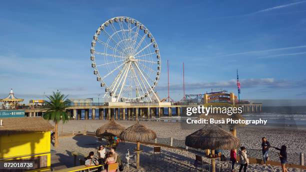 will steel pier's observation wheel on the waterfront in atlantic city, new jersey - atlantic city steel pier stock pictures, royalty-free photos & images