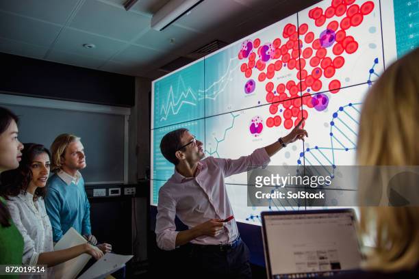 learning about dna phenotyping - person in education stock pictures, royalty-free photos & images