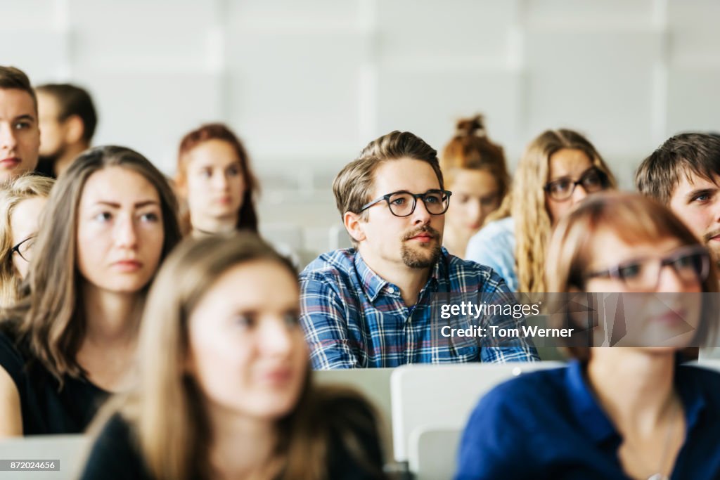 Young Students Concentrating On Professor During Lecture