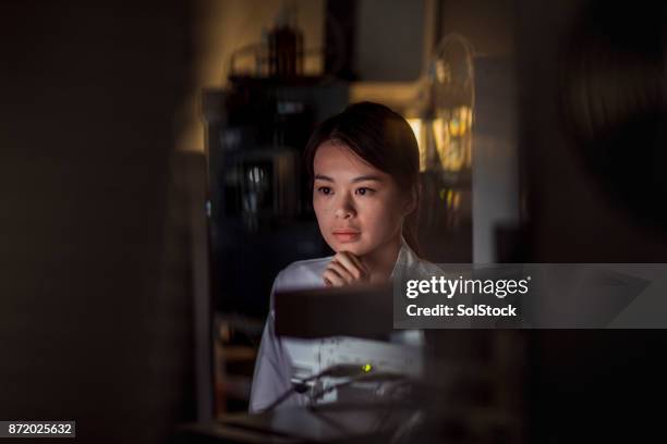 female laboratory research analyst - plasma cell stock pictures, royalty-free photos & images