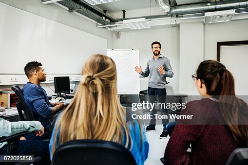 Engineer Seminar Engineering Tutor Explaining Concept During University Seminar High-Res ...