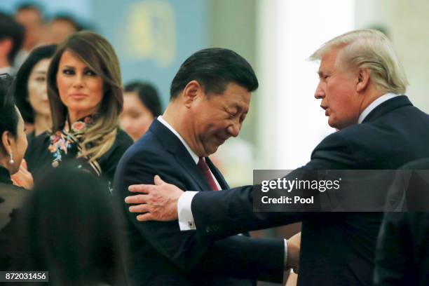 China's President Xi Jinping and China's first lady Peng Liyuan and U.S. President Donald Trump and first lady Melania attend a state dinner at the...