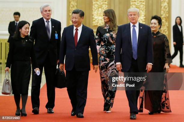 President Donald Trump and first lady Melania arrive for the state dinner with China's President Xi Jinping and China's first lady Peng Liyuan at the...
