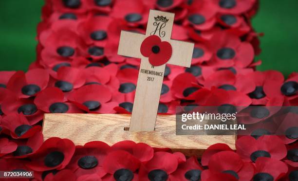 The Cross of Remembrance placed by Britain's Prince Harry is pictured following his visit to the Field of Remembrance at Westminster Abbey in central...