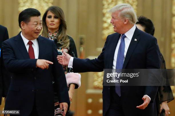 President Donald Trump and China's President Xi Jinping arrive at a state dinner at the Great Hall of the People on November 9, 2017 in Beijing,...