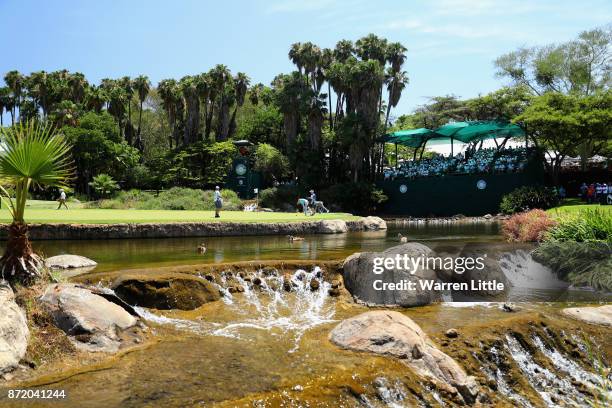 Players putt out on the ninth green during the first round of the Nedbank Golf Challenge at Gary Player CC on November 9, 2017 in Sun City, South...