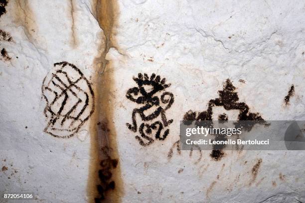 Representation of a Shamanic figure in the interior of the “Grotta dei Cervi” on July 31, 2017 in Salento, Italy. Initially named the Cave of Aeneas...